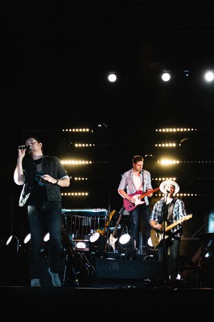 Scotty McCreery, country music artist, performs at the free 16th-annual We Salute You event on Marine Corps Air Ground Combat Center, Twentynine Palms, Calif., May 18, 2019. The event was held to thank military members at the Combat Center for their service. (U.S. Marine Corps photo by Lance Cpl. Colton Brownlee)