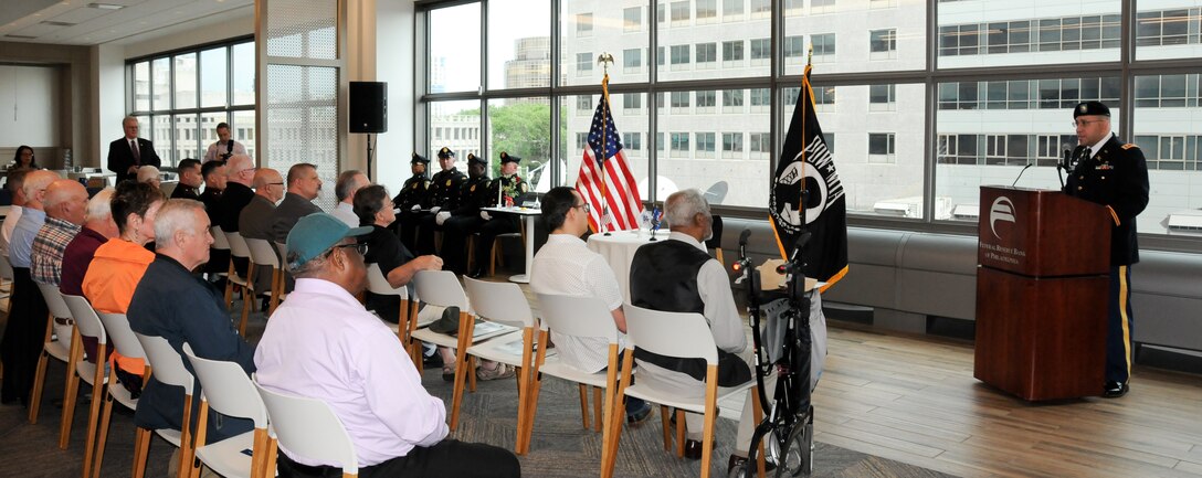 Maj. Vic Aviles, G-3 operations officer for the U.S. Army Reserve’s 99th Readiness Division headquartered on Joint Base McGuire-Dix-Lakehurst, New Jersey, addresses the audience as the Federal Reserve Bank of Philadelphia hosts its third-annual Memorial Day remembrance ceremony May 23 at its headquarters to honor those men and women in uniform who have made the ultimate sacrifice in service to the nation. The Federal Reserve Bank of Philadelphia is one of the 12 regional Reserve Banks that, together with the Board of Governors in Washington, D.C., make up the Federal Reserve System. The institution holds a remembrance ceremony the Thursday before Memorial Day every year.