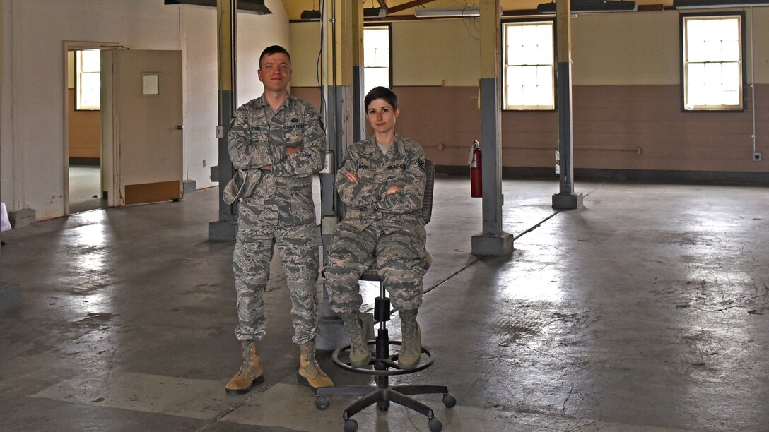 U.S. Air Force Master Sgt. Steel, 517th Training Group command language manager, and Staff Sgt. Brittany Baze, 314th Training Squadron curriculum support, pose within a building being renovated for the future Cryptologic Language Analysists Prep Course at Presidio of Monterey, Calif. May 9, 2019. The class will be open to all languages to help students acquire the tools they need to become the best linguists they can be. (U.S. Air Force photo by Airman 1st Class Zachary Chapman/Released)