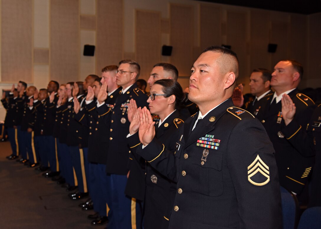 Inductees with the 344th Military Intelligence Battalion recite the Noncommissioned Officer Creed as they prepare to join the NCO Corps, at the NCO Induction Ceremony at the base theater on Goodfellow Air Force Base, Texas, May 21, 2019. The NCO Creed is a time-honored Army tradition that started in 1973. (U.S. Air Force photo by Airman 1st Class Ethan Sherwood/Released)