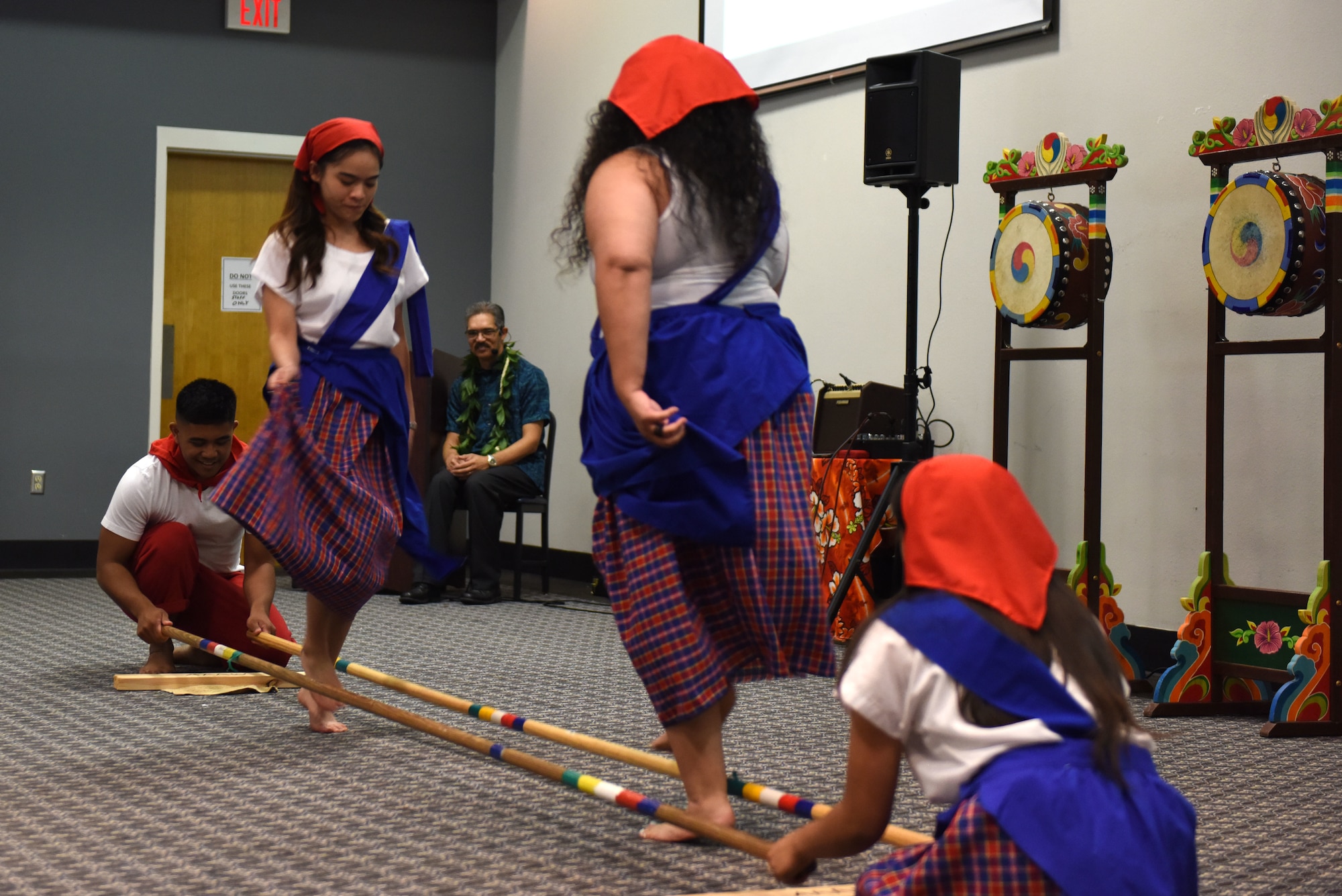 Performers at the Asian American Pacific Islander Heritage Month Culture Event demonstrate a Filipino dance “Tinikling” at the event Center on Goodfellow Air Force Base, Texas, May 22, 2019. “Tinikling” originated during the Spanish occupation in the Philippines, where rice farmers on Visayan Islands usually set up bamboo traps to protect their fields, yet birds dodged their traps, the dance steps imitate the bird’s movements. (U.S. Air Force photo by Senior Airman Seraiah Hines/Released)
