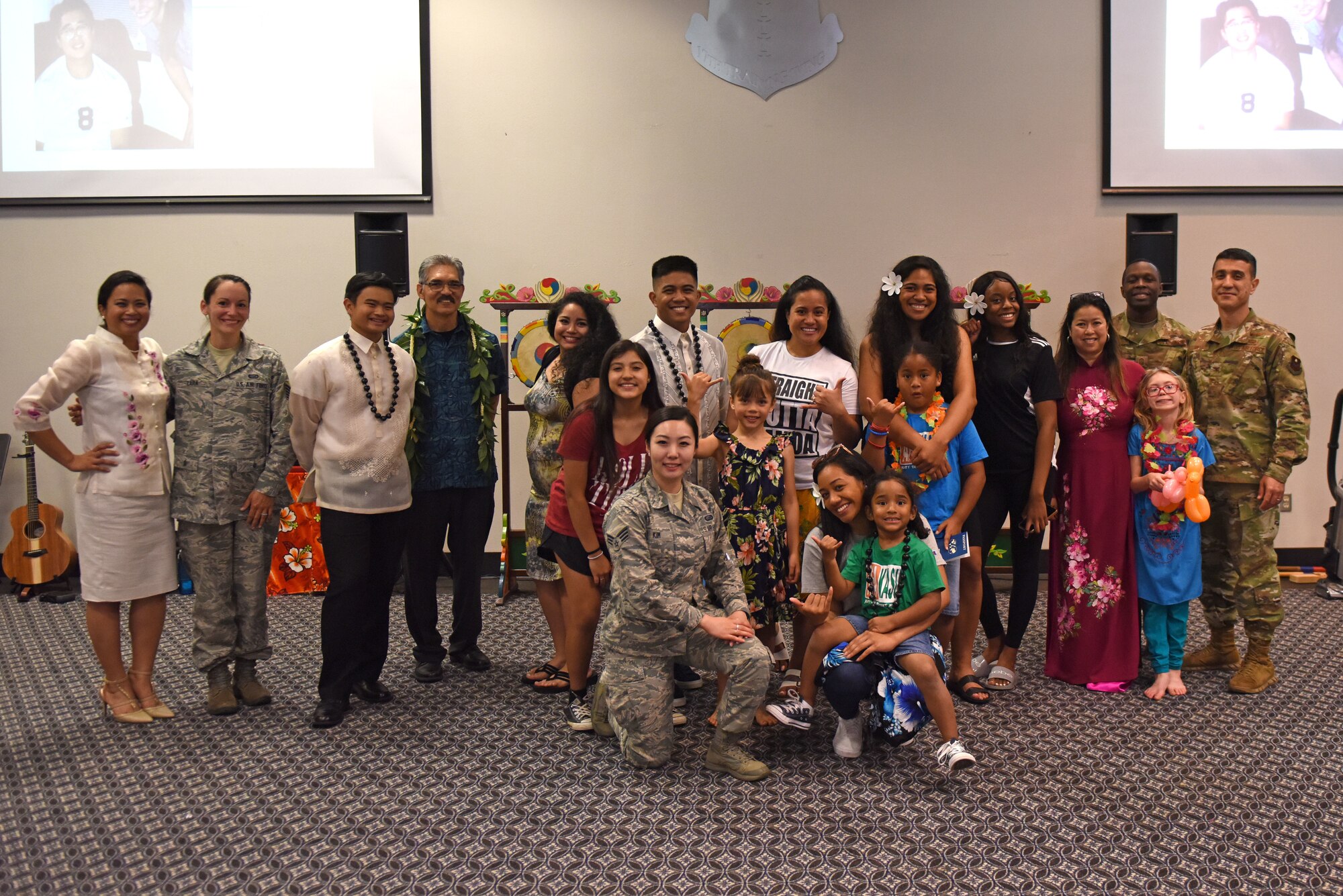 Participants and volunteers for the Asian American Pacific Islander Heritage Month Event take time before clean up for a group photo at the event center on Goodfellow Air Force Base, Texas, May 22, 2019. This was a final event in a series highlighting the service and sacrifices of the Asian Pacific Islanders throughout the United States. (U.S. Air Force photo by Senior Airman Seraiah Hines/Released)