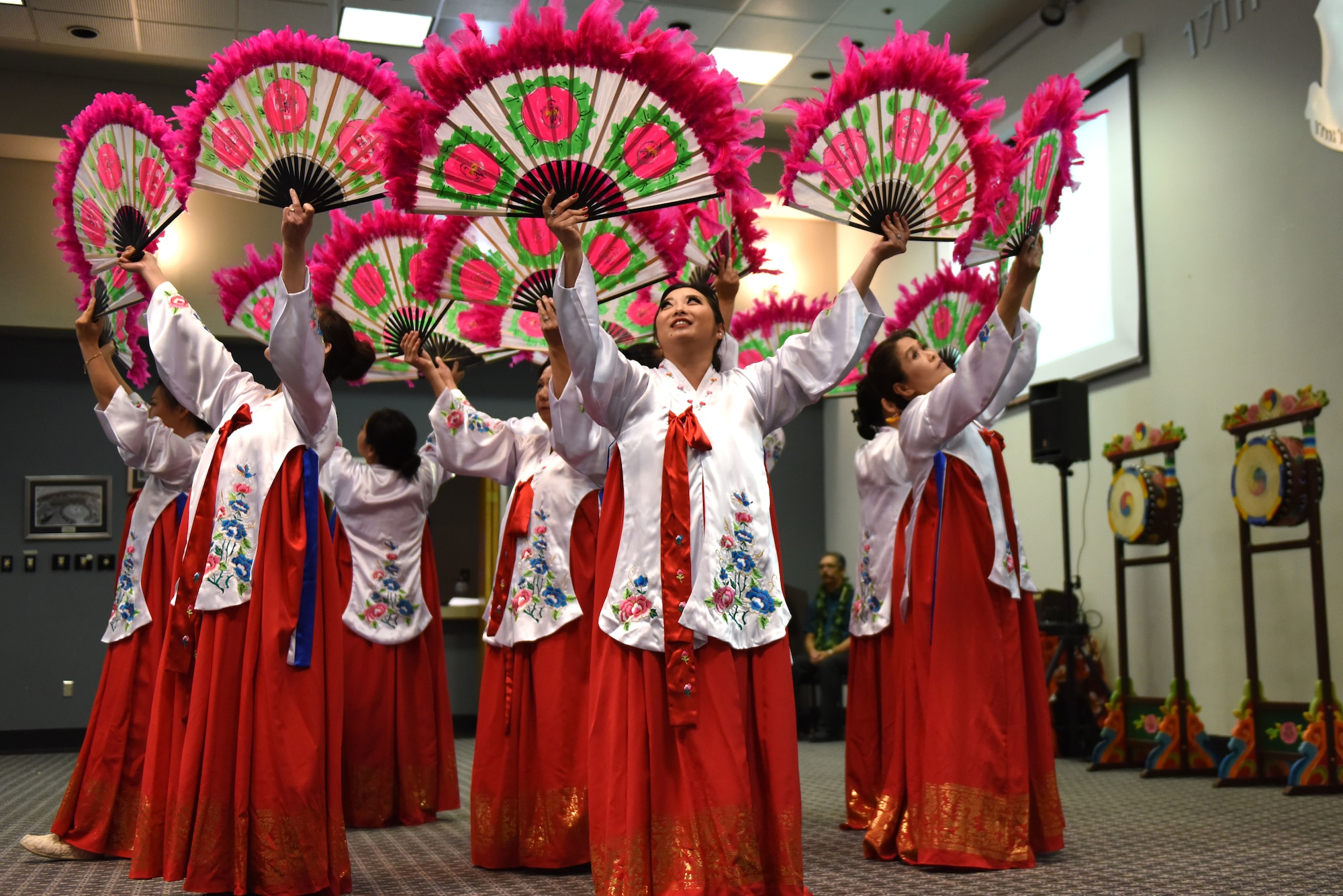 Korean dancers demonstrate a Korean Fan Dance during the Asian American Pacific Islander Heritage Month Event held at the event center on Goodfellow Air Force Base, Texas, May 22, 2019. The court of the Jo-Sun dynasty was the basis for the intricate costuming and very precise movements. (U.S. Air Force photo by Senior Airman Seraiah Hines/Released)