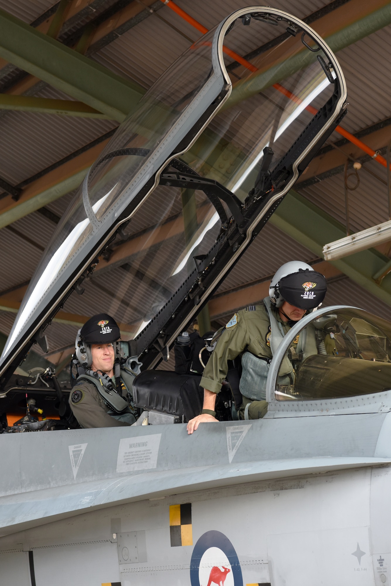 Two Royal Australian Air Force (RAAF) F/A-18B Hornet pilots prepare for takeoff during Exercise Diamond Storm at Royal Australian Air Force Base Darwin, Northern Territory, May 10, 2019.