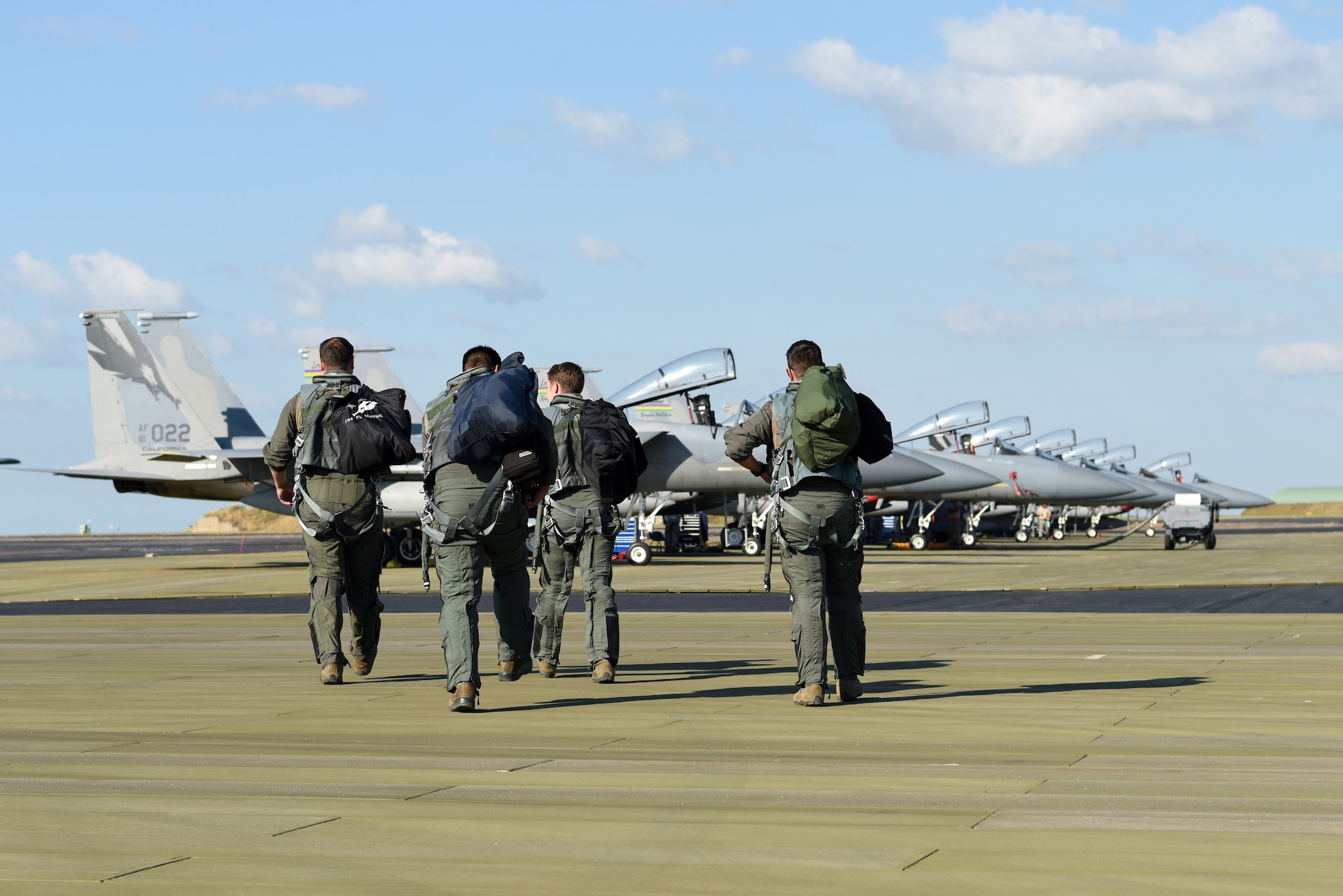 U.S. Air Force pilots assigned to the 194th Expeditionary Fighter Squadron (EFS), California Air National Guard, step to their F-15C Eagles during Exercise Diamond Storm at Royal Australian Air Force Base Darwin, Northern Territory, May 13, 2019.
