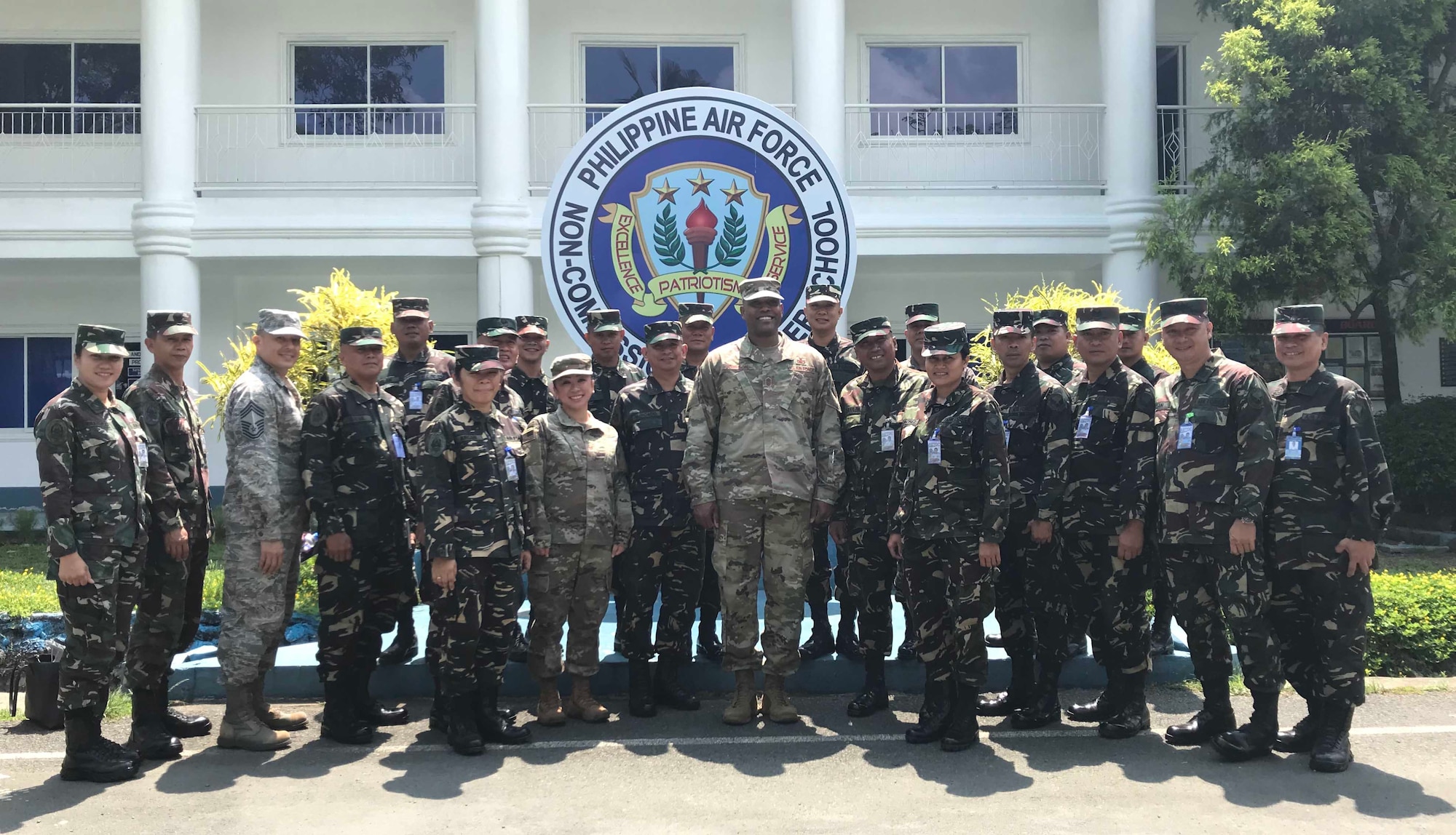 Chief Master Sgt. Anthony Johnson, Pacific Air Forces command chief, poses with members of the Philippine Air Force (PAF) during a visit to Basilio Fernando Air Base, May 17.  During his visit, Johnson met with Air Education, Training and Doctrine Command Sergeant Major Ruperto Rodel Moreto and toured PAF facilities which included Basic Military Training, Non-Commissioned Officer School, Technical and Specialization Training and airmen dormitories.