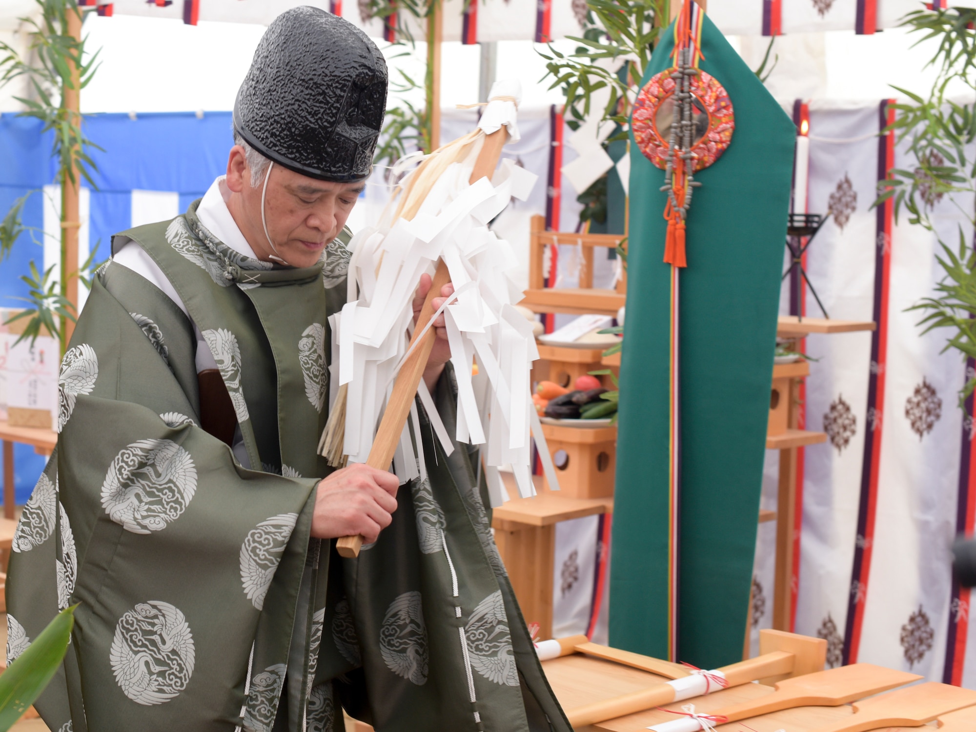 A priest purifies the liquid natural gas site and prays for the safety of personnel during the ground-breaking ceremony for the new liquid natural gas plant at Misawa Air Base, Japan, May 15, 2019. Members of the 35th Civil Engineer Squadron gathered together for a traditional Shinto-style ceremony before construction of the liquid gas plant began. A Shinto-style ceremony derives from the traditional religion of Japan and focuses on ritual practices. (U.S. Air Force photo by 1st Lt. Jeremy E. Garcia)