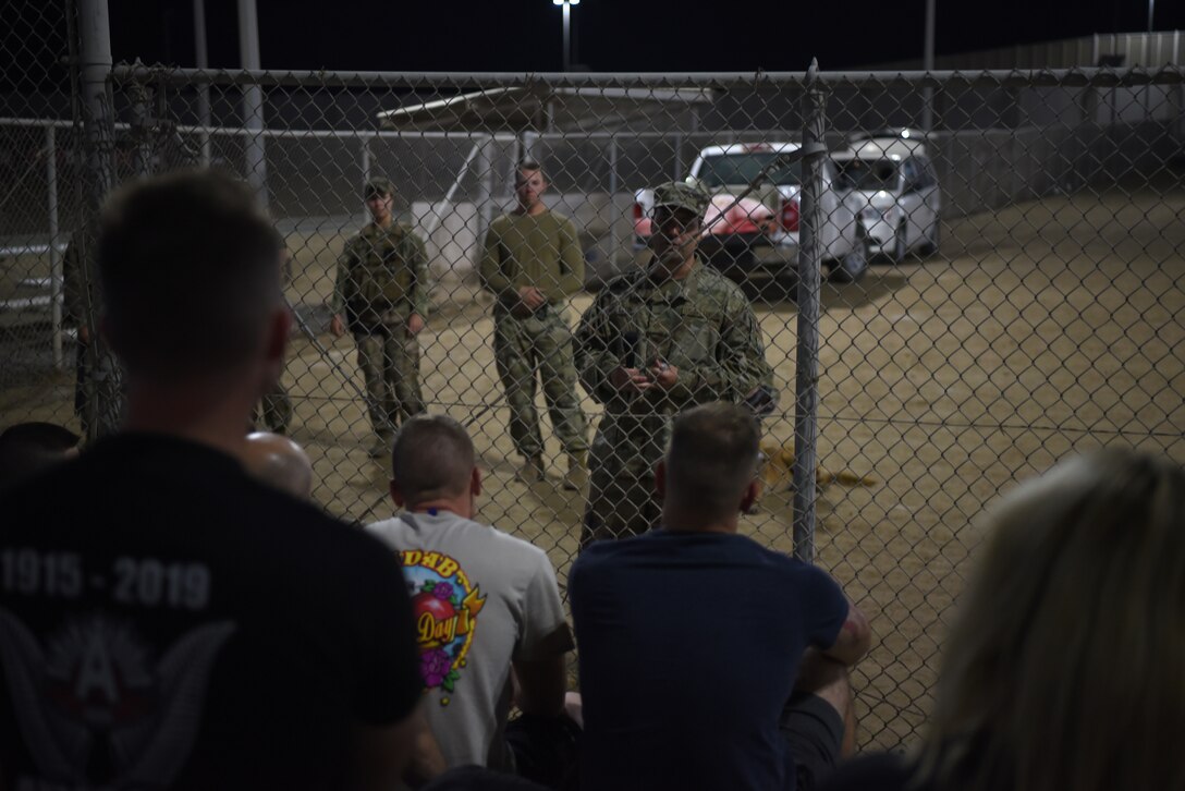 Military working dog handlers answer question about the abilities and training of the K-9 unit during Police Week 2019, May 13, 2019, at Al Dhafra Air Base, United Arab Emirates.