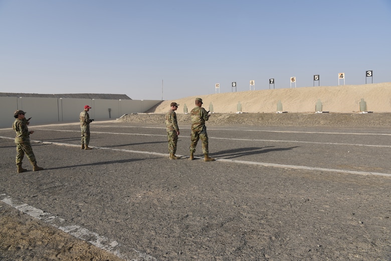 Members of the 380th Air Expeditionary Wing participate in a pistol competition during Police Week 2019, May 13, 2019, at Al Dhafra Air Base, United Arab Emirates.