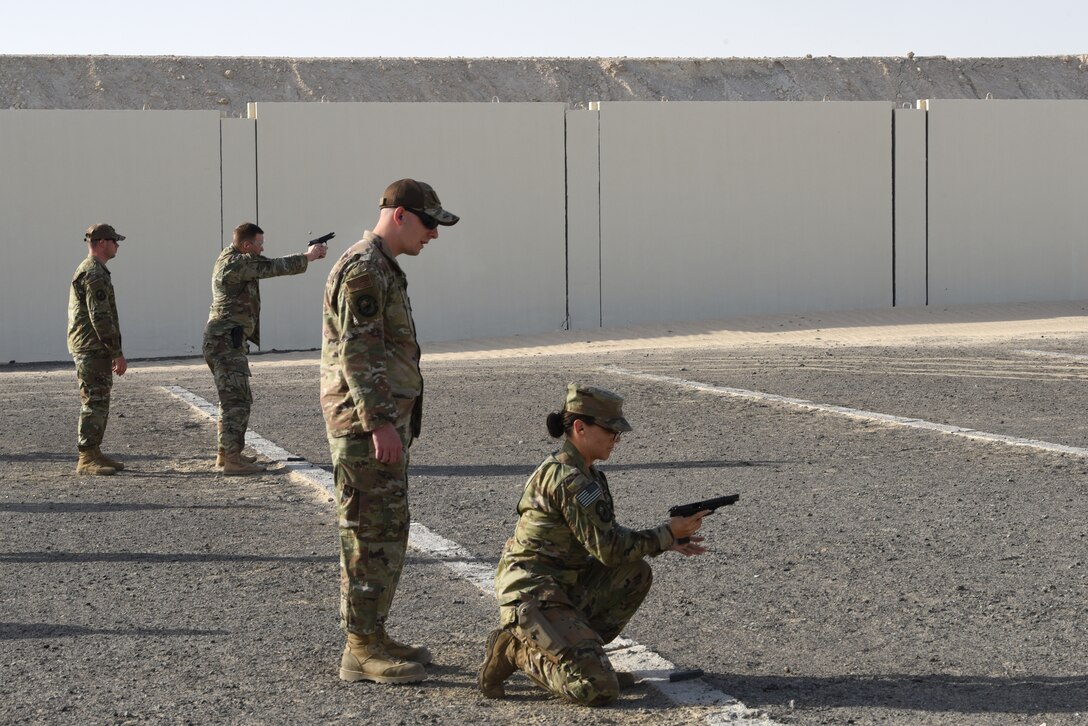 Members of the 380th Air Expeditionary Wing participate in a pistol competition during Police Week 2019, May 13, 2019, at Al Dhafra Air Base, United Arab Emirates.