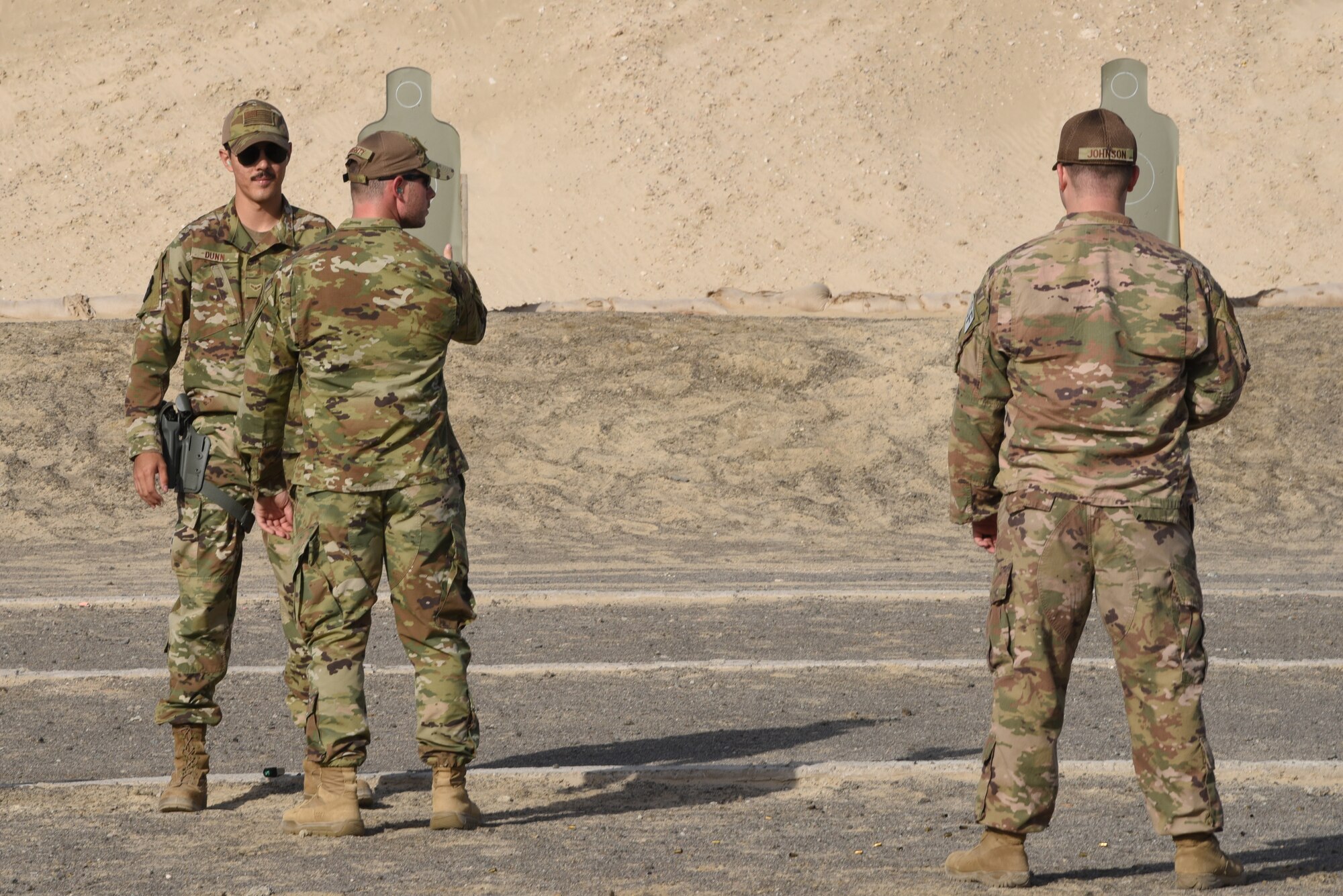 A member of the 380th Air Expeditionary Wing awaits the order to turn and fire during a pistol competition during Police Week 2019, May 13, 2019, at Al Dhafra Air Base, United Arab Emirates.