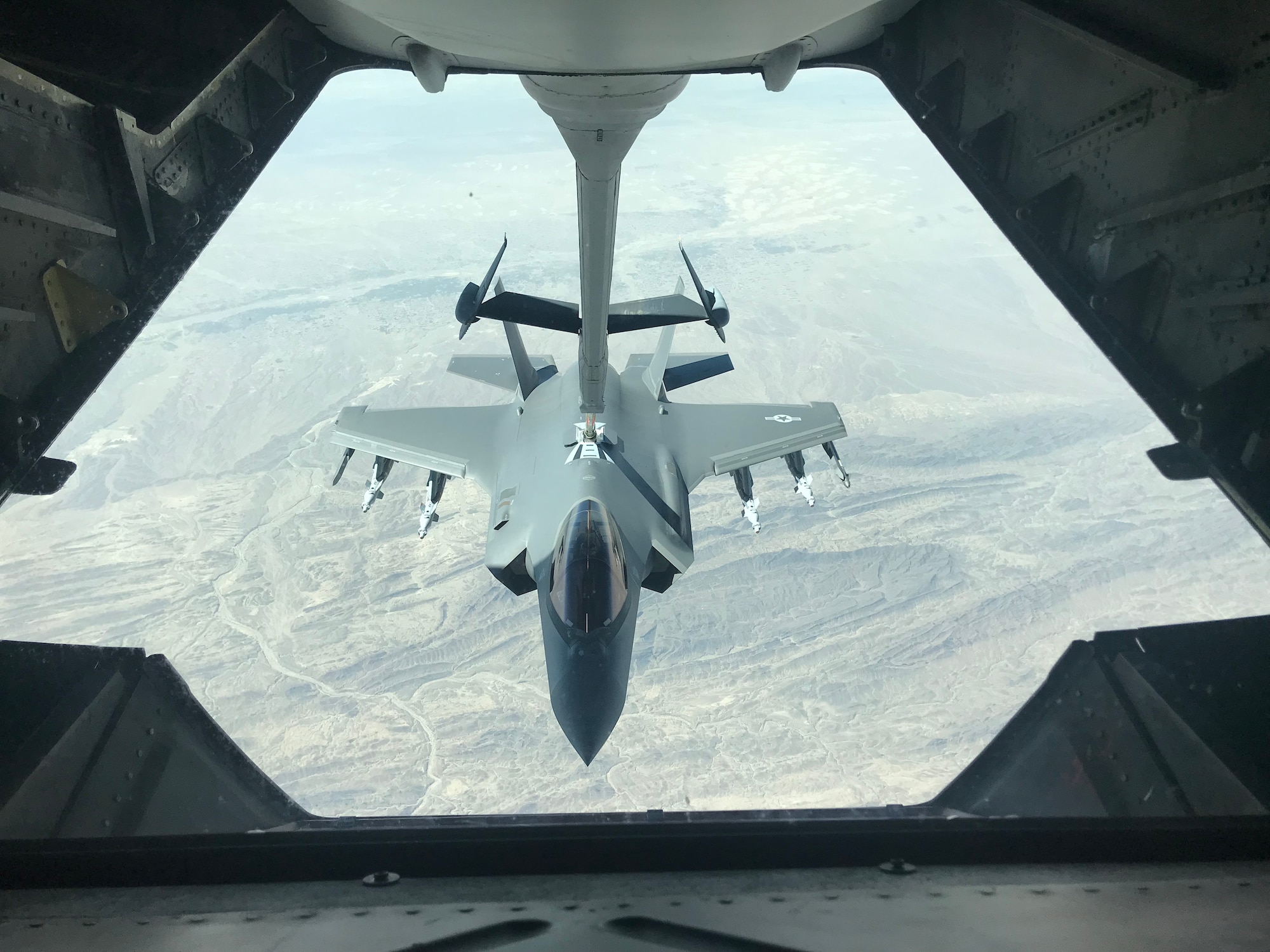 An F-35A Lightning II approaches a KC-10 Extender for aerial refueling  during an operation in support of U.S. Forces – Afghanistan, May 2019. The F-35A conducted the mission with a full external loadout, six GBU-49 small glide munitions and two AIM-9x Sidewinder missiles. The F-35A is assigned to the 4th Expeditionary Fighter Squadron, and the KC-10 Extender is assigned to the 908th Expeditionary Air Refueling Squadron at Al Dhafra Air Base, United Arab Emirates. (U.S. Air Force Photo)