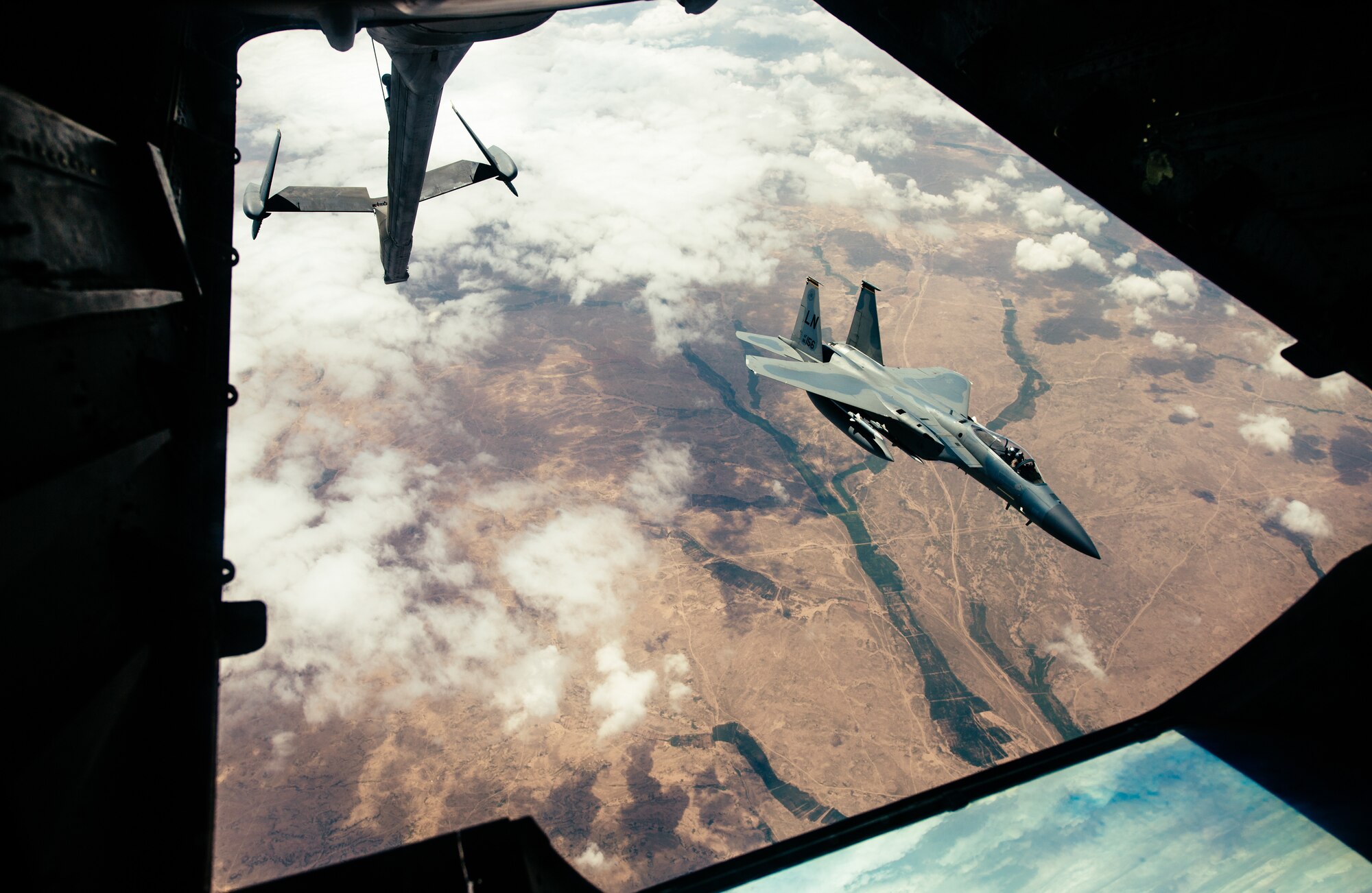 A U.S. Air Force F-15 Eagle peels away from a 908th Expeditionary Aerial Refueling Squadron KC-10 Extender after receiving fuel in support of Operation Inherent Resolve, March 17, 2019. The 908th EARS empowers the fight against ISIS by providing mission extending aerial refueling services to U.S. and Coalition forces conducting operations in OIR's area of responsibility. (U.S. Air Force photo by Staff Sgt. Jordan Castelan)