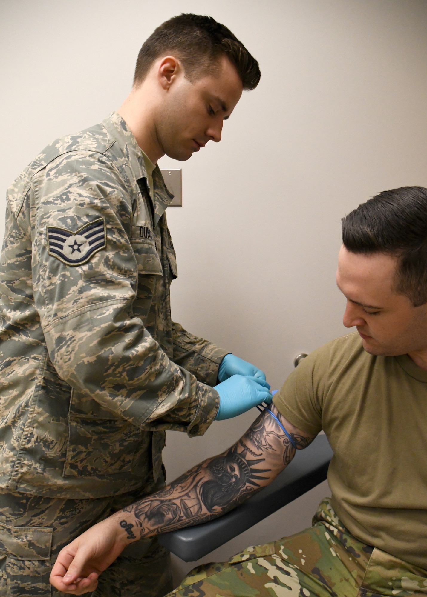 Staff Sgt. Jonathan Duncan, 104th Medical Group aerospace medical technician, prepares to take a blood sample at Barnes Air National Guard Base, Massachusetts, May 10, 2019. Duncan recently graduated from Massachusetts College of Liberal Arts with a degree in biology with a medical focus. (U.S. Air National Guard photo by Airman 1st Class Randy Burlingame)