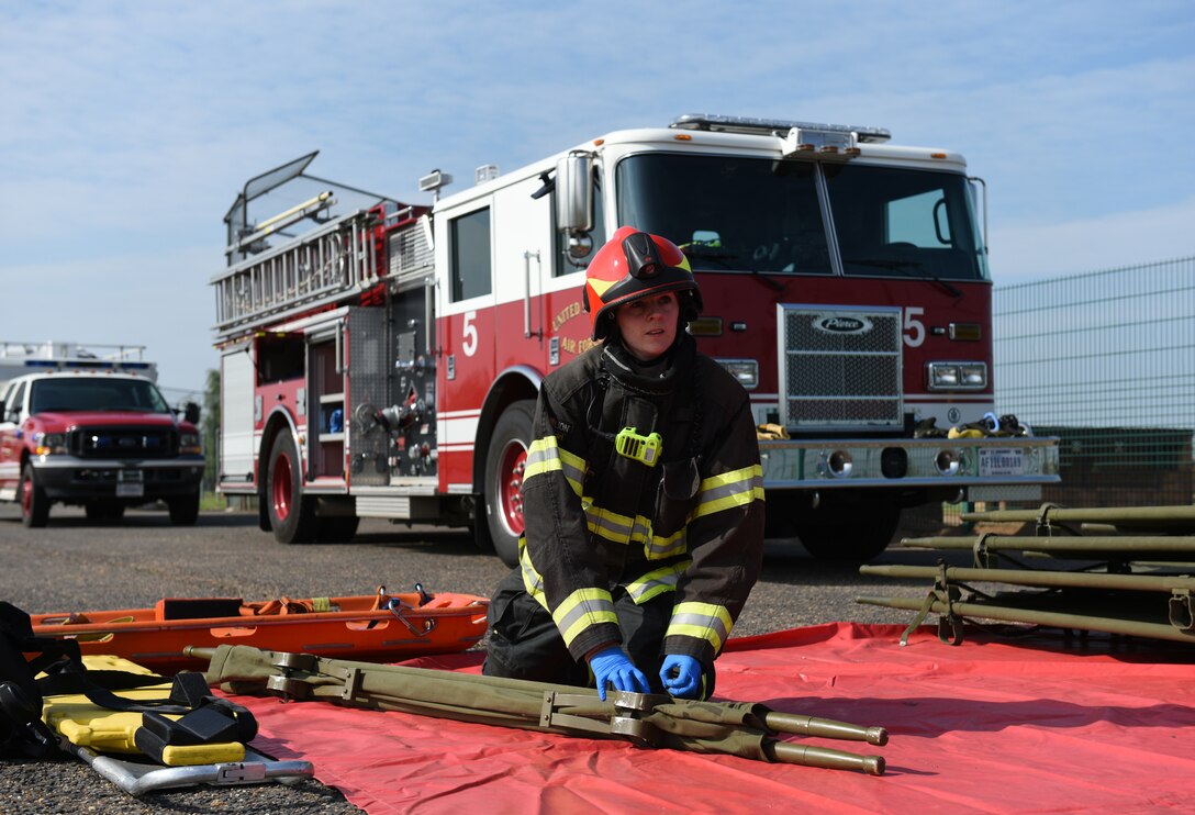 Kerry Hyde, 423rd Civil Engineer Squadron firefighter crew manager, prepares equipment during a preparedness exercise at RAF Alconbury, England, May 20, 2019. The exercise tested the 501st Combat Support Wing preparedness and response capabilities to an emergency situation. (U.S. Air Force photo by Airman 1st Class Jennifer Zima)