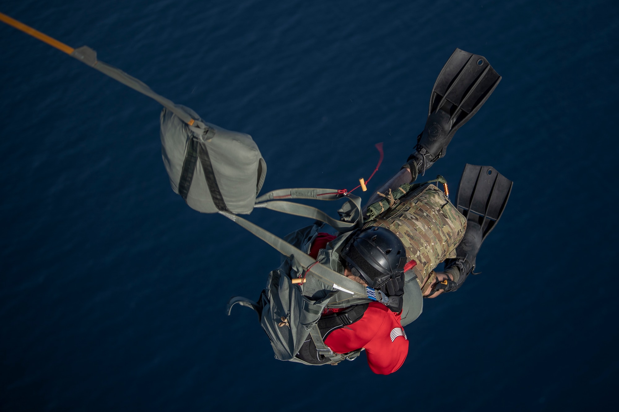 A pararescueman participates in a static line parachute jump