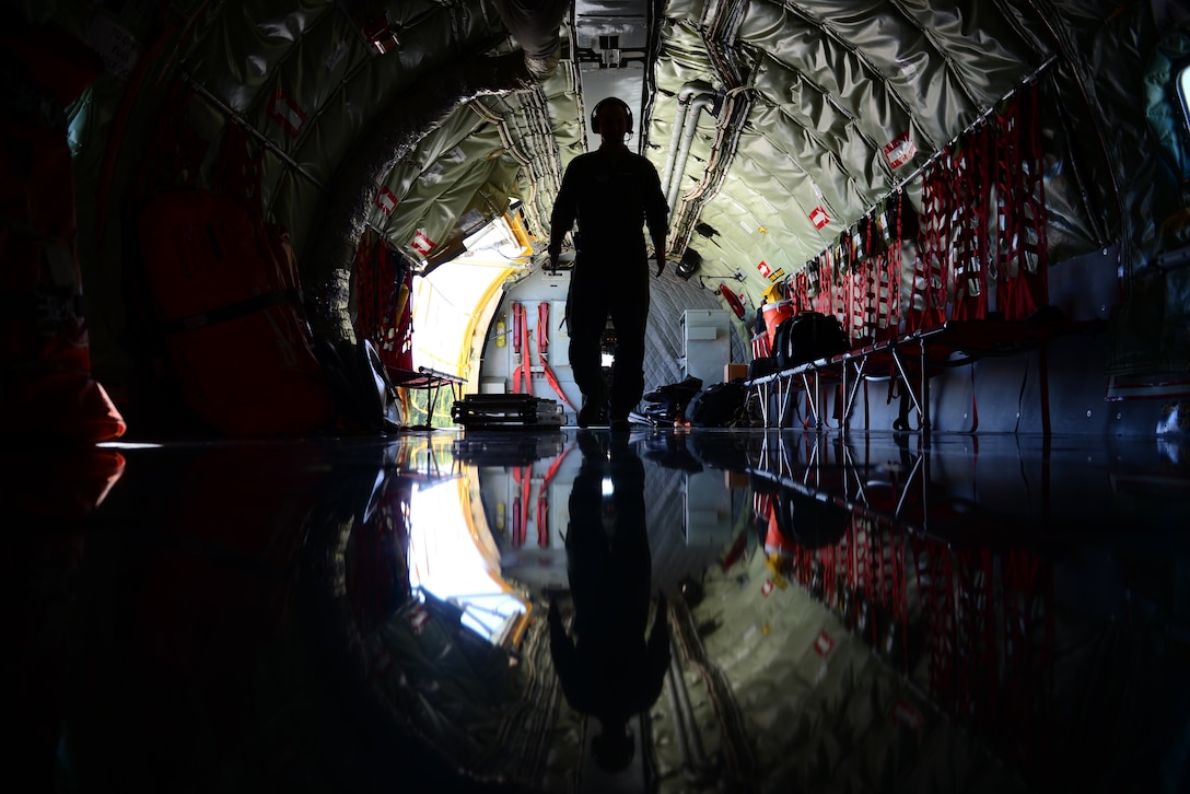 A boom operator walks through a KC-135R Stratotanker