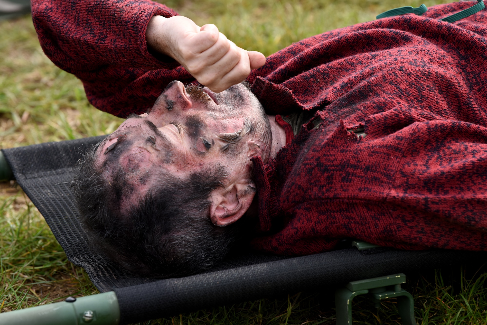 A simulated trauma patient in a training exercise scenario lays on a stretcher at a British Army training site in Thetford, England, May 19, 2019. The 48th MDG and U.K. partners participated in an exercise containing trauma patients and skills-based training to enhance individual readiness and to build on the interoperability between the two nations. (U.S. Air Force photo by Airman 1st Class Madeline Herzog