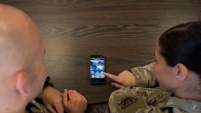 Tech. Sgt. Daniel Johnson and Staff Sgt. Alysha Henzler, 366th Fighter Wing Airmen dorm leaders, review the app, “Gunfighter Dorms”, they developed May 23, 2019, at Mountain Home Air Force Base, Idaho. The app was created to provide readily available resources for Airmen living in the dorms like the ability to submit work orders, look at a social events calendar and emergency contacts.