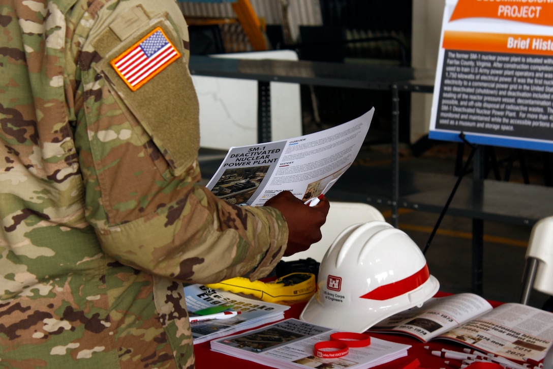 A Soldier reads an informational handout about the ongoing planning for the final decommissioning and dismantling of the Deactivated SM-1 Nuclear Power Plant at Fort Belvoir during the Army Aviation Brigade's Safety Stand Down at Davison Army Airfield Thursday May 23, 2019. The SM-1 project team participated in the event as part of ongoing outreach efforts to inform members of the Fort Belvoir community about the SM-1 project, help create an understanding of the nature of the project and address potential concerns. More information about the SM-1 project is available online at www.nab.usace.army.mil/SM-1