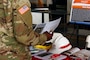 A Soldier reads an informational handout about the ongoing planning for the final decommissioning and dismantling of the Deactivated SM-1 Nuclear Power Plant at Fort Belvoir during the Army Aviation Brigade's Safety Stand Down at Davison Army Airfield Thursday May 23, 2019. The SM-1 project team participated in the event as part of ongoing outreach efforts to inform members of the Fort Belvoir community about the SM-1 project, help create an understanding of the nature of the project and address potential concerns. More information about the SM-1 project is available online at www.nab.usace.army.mil/SM-1