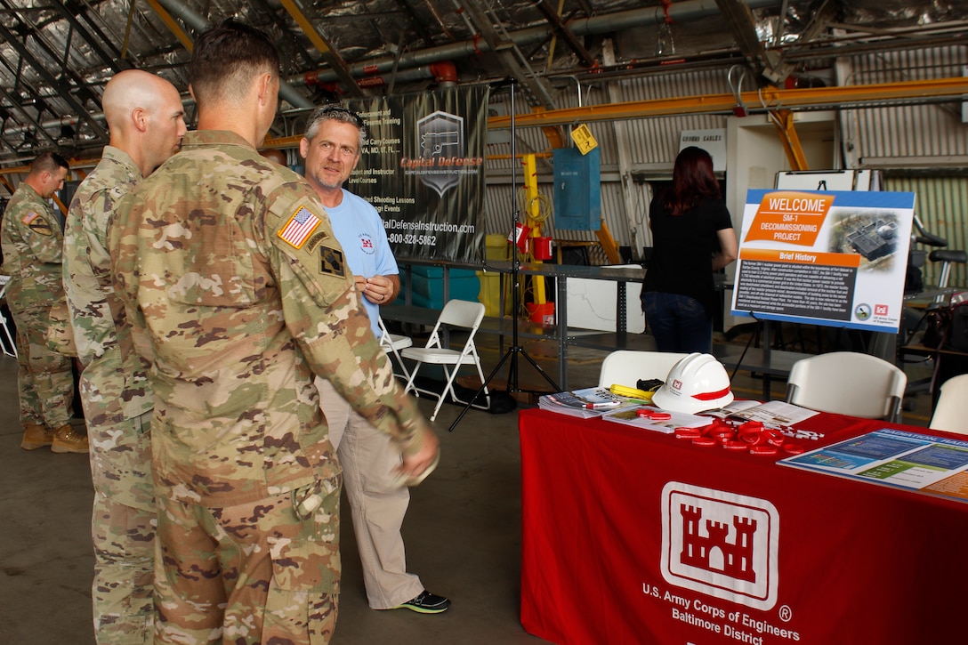 U.S. Army Corps of Engineers Radiological Health Physicist Hans Honerlah speaks with Soldiers at the U.S. Army Aviation Brigade's Safety Stand Down at Davison Army Airfield about the ongoing planning for the final decommissioning and dismantling of the Deactivated SM-1 Nuclear Power Plant at Fort Belvoir Thursday May 23, 2019. The SM-1 project team participated in the event as part of ongoing outreach efforts to inform members of the Fort Belvoir community about the SM-1 project, help create an understanding of the nature of the project and address potential concerns. More information about the SM-1 project is available online at www.nab.usace.army.mil/SM-1