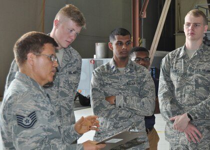 Tech. Sgt. William M. Holland 433rd Maintenance Squadron propulsion mechanic, briefs University of North Texas Air Force ROTC cadets about the C-5M Super Galaxy’s new engine, May 16, 2019, at Joint Base San Antonio-Lackland, Texas. Holland explained the benefits of the new engines.