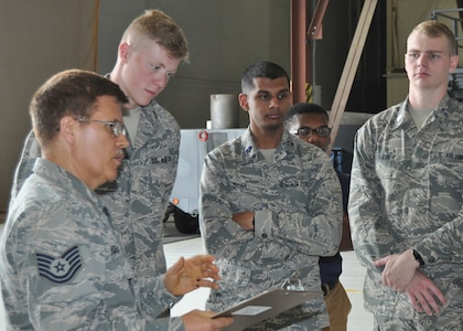 Tech. Sgt. William M. Holland 433rd Maintenance Squadron propulsion mechanic, briefs University of North Texas Air Force ROTC cadets about the C-5M Super Galaxy’s new engine, May 16, 2019, at Joint Base San Antonio-Lackland, Texas. Holland explained the benefits of the new engines.