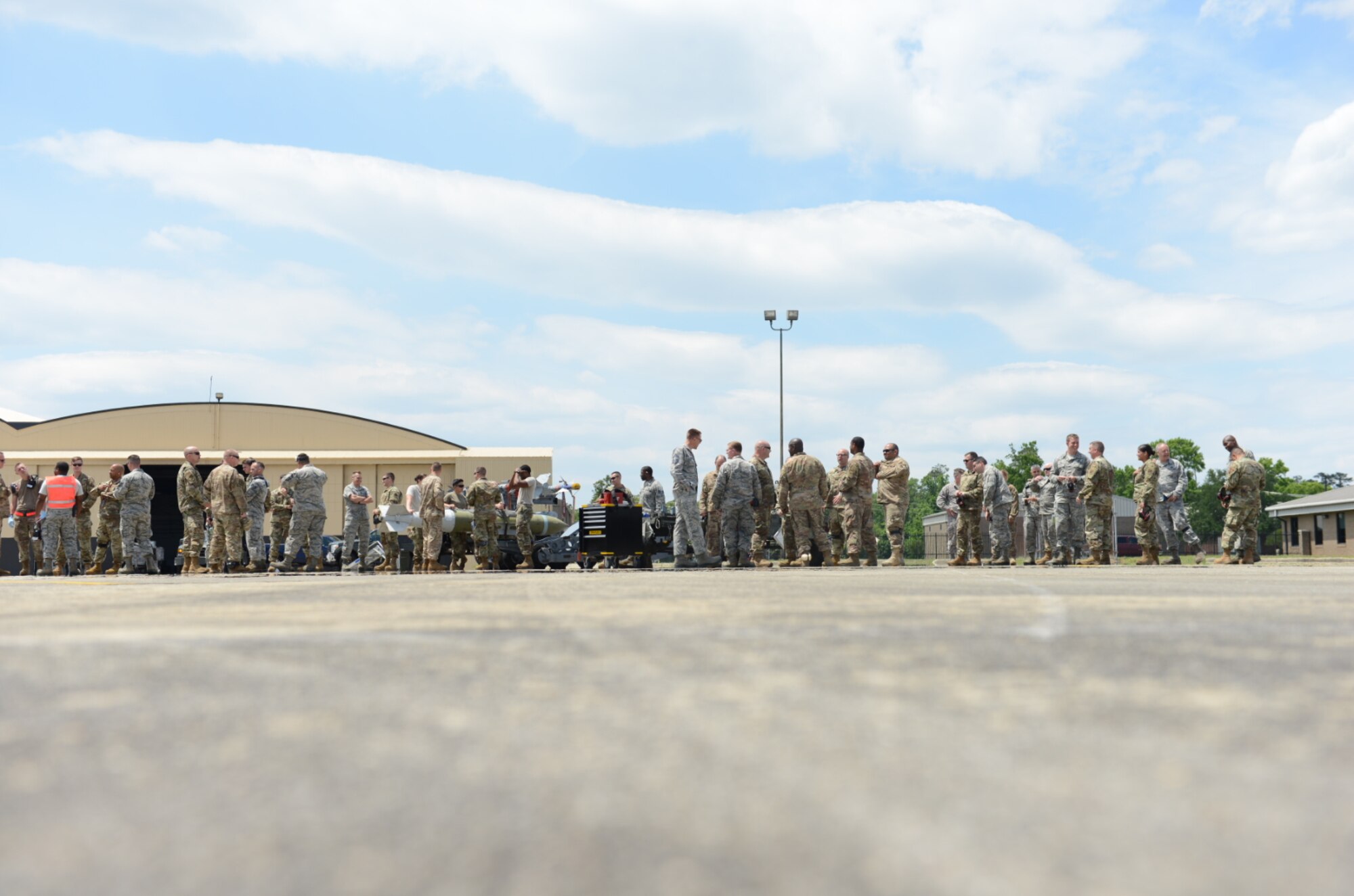 U.S. Airmen gather to watch a Hot Integrated Combat Turnaround trial at Shaw Air Force Base, S.C., May 15, 2019.
