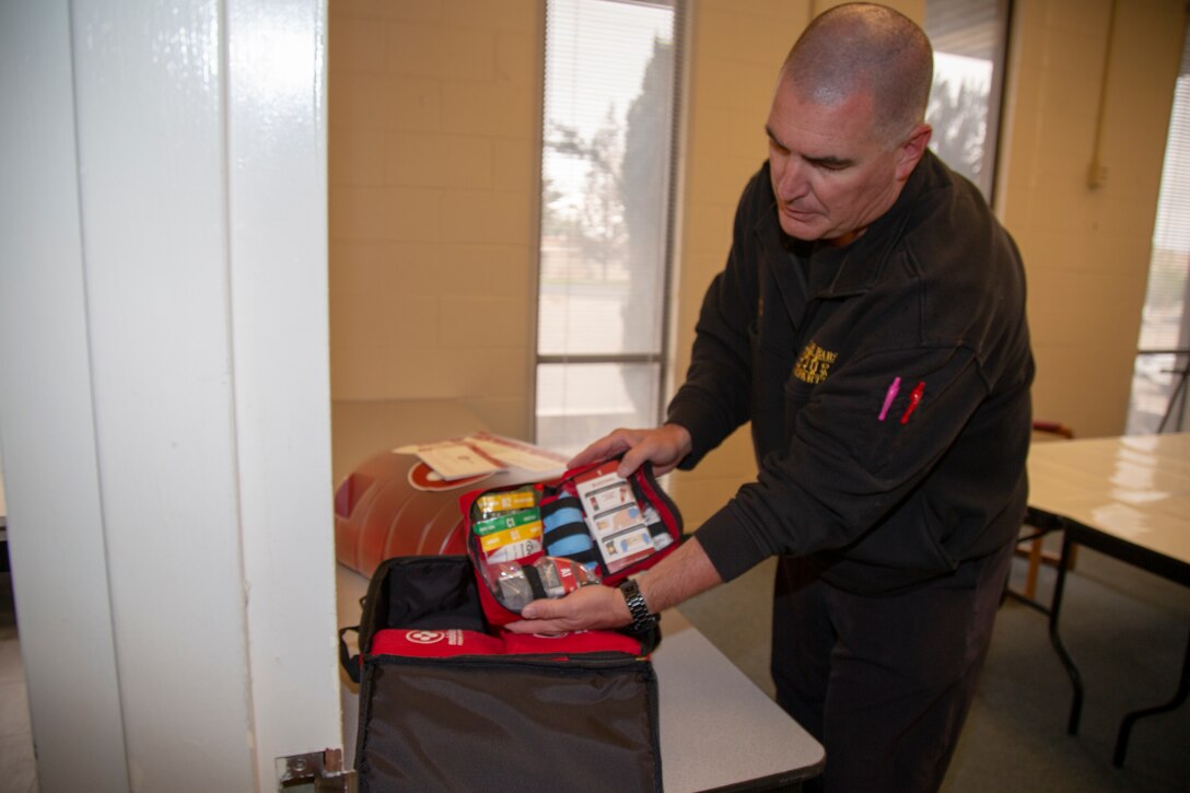 Greg Kunkle, Emergency Medical Services Chief for Fire and Emergency Services displays one of the four trauma kits contained within the Public Access Stations which will be located throughout Marine Corps Logistics Base Barstow, Calif. May 22. The kits are part of the “Stop the Bleed” campaign embraced by fire departments throughout the state, and contain all of the necessary equipment to render first aid during emergency incidents.