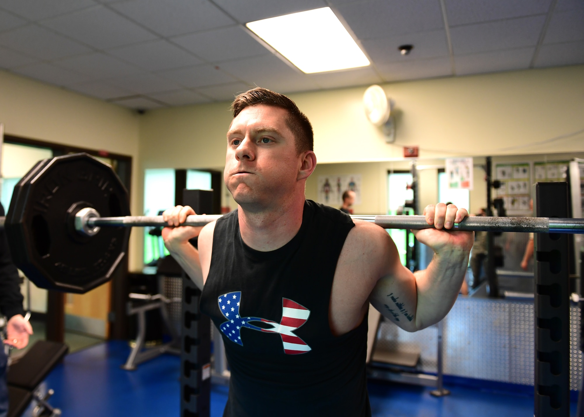 Tech. Sgt. David Novak, 911th Airlift Wing intelligence analyst, participates in the 911th Security Forces Law Enforcement Week squat portion of the combo lift at the Pittsburgh International Airport Air Reserve Station, Pennsylvania, May 15, 2019. The combo lift was the second during Law Enforcement Week celebrations. (U.S. Air Force photo by Senior Airman Grace Thomson)