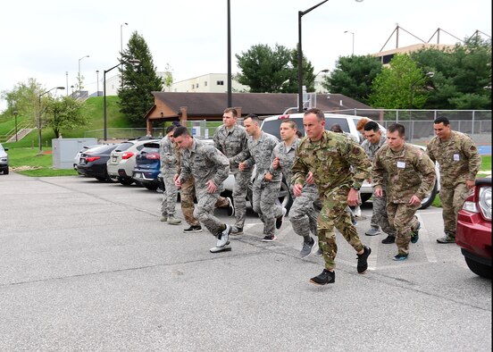 Airmen assigned to the 911th Airlift Wing begin a two-mile run as part of the U.S. Army physical fitness test at the Pittsburgh International Airport Air Reserve Station, Pennsylvania, May 4, 2019. In order to qualify for the Combat Air Assault training, candidates must pass a U.S. Army physical fitness test 30 days before the school starts to ensure they have the strength and endurance needed to complete the course. (U.S. Air Force photo by Senior Airman Grace Thomson)