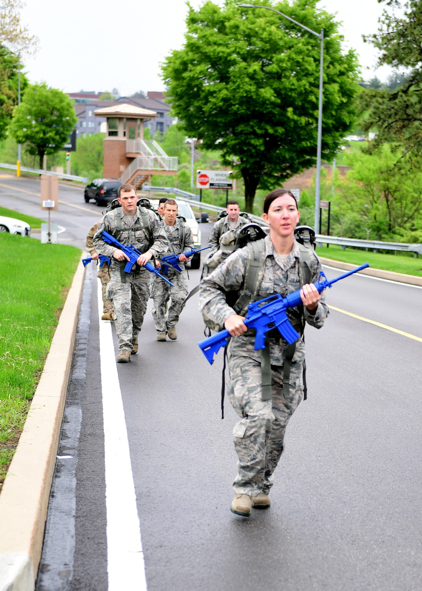 Senior Airman Karissa Lee, 911th Security Forces Squadron personnel specialist, leads the pack of 911th Airlift Wing Airmen on a ruck march at the Pittsburgh International Airport Air Reserve Station, Pennsylvania, May 5, 2019. A ruck march is when Airmen carry a backpack full of weights and walk at a vigorous pace over a predetermined course to build up their physical and mental endurance. (U.S. Air Force photo by Senior Airman Grace Thomson)