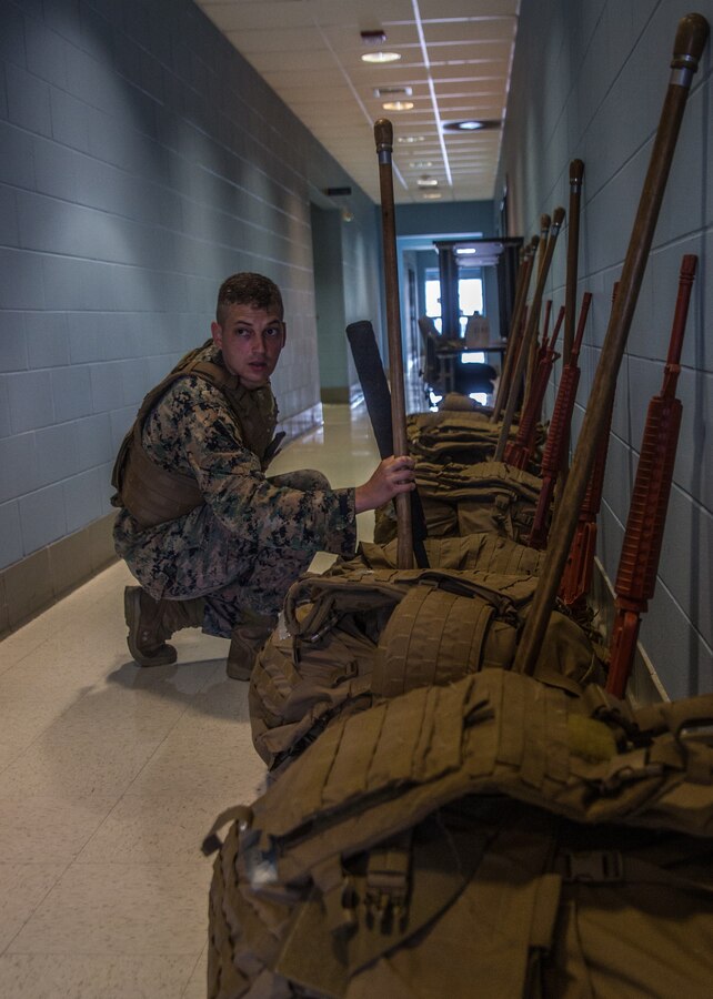 U.S. Marine Corps Sgt. Neil Biangel, an aviation ordnance systems technician with Marine Aircraft 49, 4th Marine Aircraft Wing, Marine Forces Reserve, prepares his gear for a training evolution during Martial Arts Instructor Course 1-19 at Naval Air Station Joint Reserve Base New Orleans on May 22, 2019. To increase readiness and to support the total force, Reserve and active Marines with MARFORRES participate in the MAI Course. (U.S. Marine Corps photo by Lance Cpl. Preston L. Morris)