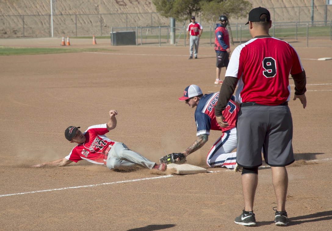 MCLB Barstow's Sgt Jesse Curtis, slides in to third base during an Armed Forces Day Softball Tournament held at the Robert A. Sessions Sportspark, in Barstow, May 18. Curtis eventually scored but MCLB lost to the NTC Ft. Irwin team, 15 - 6.
