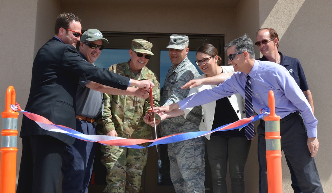 Ribbon-cutting participants, (l-r): Dr. David Chapman, AGT program manager; Barry Bunn, deputy director, Space Vehicles Directorate., Col. Eric J. Felt, commander, Space Vehicles Directorate; Lt. Col. Gregory Izdepski, deputy division chief, Geospace Technologies; Maria Mendoza, project manager, AFRL; Michael Goodrich, chief, Military and IIS Project Management Branch, Albuquerque District, USACE; and Jon Anthony, construction contractor, QA Engineering.