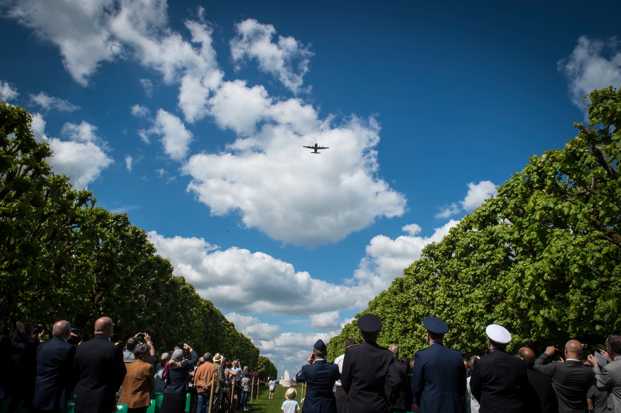 A 37th Airlift Squadron C-130J Super Hercules conduct a flyover during a Memorial Day ceremony at the Saint-Mihiel American Cemetery, Thiaucourt-Regniéville, France, May 26, 2019. The C-130J incorporates state-of-the-art technology, which reduces manpower requirements, lowers operating and support costs, and provides life-cycle cost savings over earlier C-130 models. (U.S. Air Force photo by Staff Sgt. Jonathan Bass)