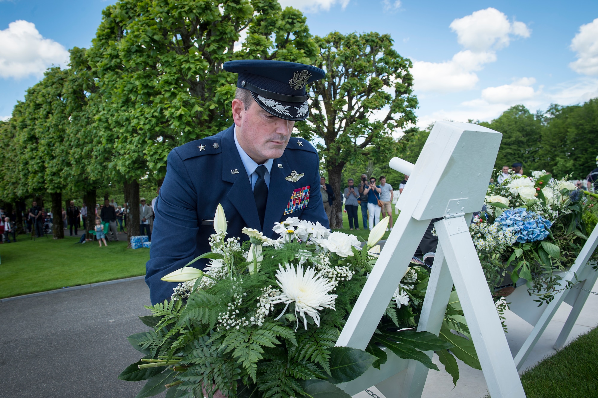 U.S. Air Force Brig. Gen. Mark R. August, 86th Airlift Wing commander, lays a wreath on a stand during a Memorial Day ceremony at the Saint-Mihiel American Cemetery, Thiaucourt-Regniéville, France, May 26, 2019. In addition to the more than 4,000 Americans who died and are buried there, the cemetery holds the names of 284 service members who are missing in action. (U.S. Air Force photo by Staff Sgt. Jonathan Bass)