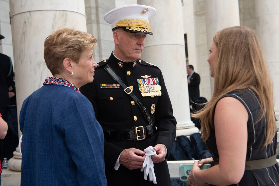 Chairman of the Joint Chiefs of Staff Marine Corps Gen. Joseph F. Dunford, Jr. and his wife,  Ellyn, talk to a woman.