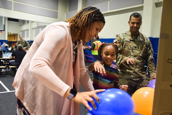 Capt. Heathra King, a U.S. Army Corps of Engineers, Far East District operations officer, interacts with a student during a Science, Technology, Engineering, and Math (STEM) event held at Humphreys Central Elementary School, Camp Humphreys, South Korea, May 23.