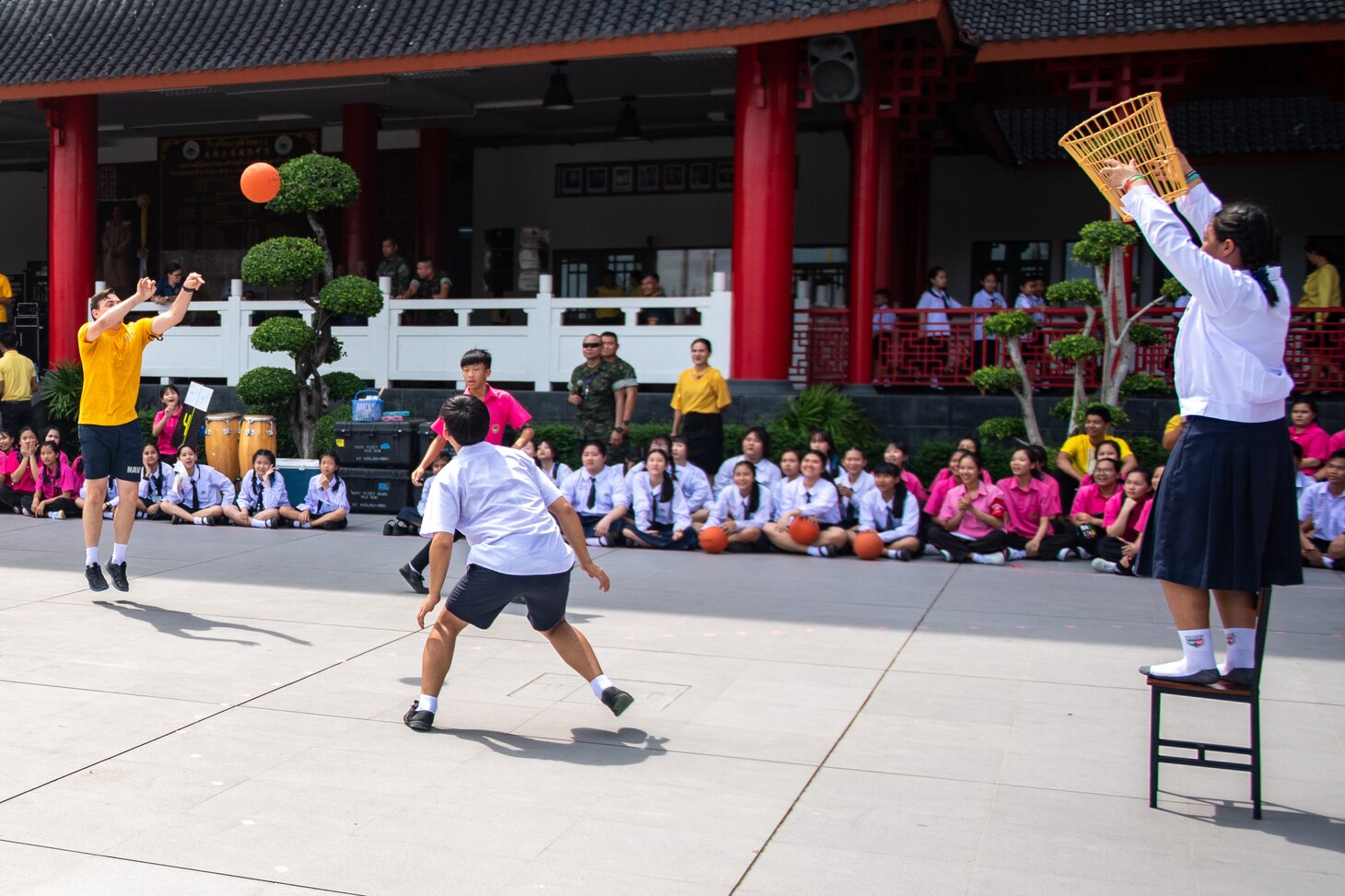 CHON BURI, Thailand (May 23, 2019) – U.S. Navy Religious Program Specialist 2nd Class Jason Hunt plays chairball with Wutthi Wittaya school students during a host nation outreach engagement as part of Pacific Partnership 2019. Pacific Partnership, now in its 14th iteration, is the largest annual multinational humanitarian assistance and disaster relief preparedness mission conducted in the Indo-Pacific. Each year the mission team works collectively with host and partner nations to enhance regional interoperability and disaster response capabilities, increase security and stability in the region, and foster new and enduring friendships in the Indo-Pacific.