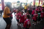 CHON BURI, Thailand (May 23, 2019) – U.S. Navy Master-at-Arms 3rd Class Jazmine Gray dances with Wutthi Wittaya school students during a host nation outreach engagement as part of Pacific Partnership 2019. Pacific Partnership, now in its 14th iteration, is the largest annual multinational humanitarian assistance and disaster relief preparedness mission conducted in the Indo-Pacific. Each year the mission team works collectively with host and partner nations to enhance regional interoperability and disaster response capabilities, increase security and stability in the region, and foster new and enduring friendships in the Indo-Pacific.