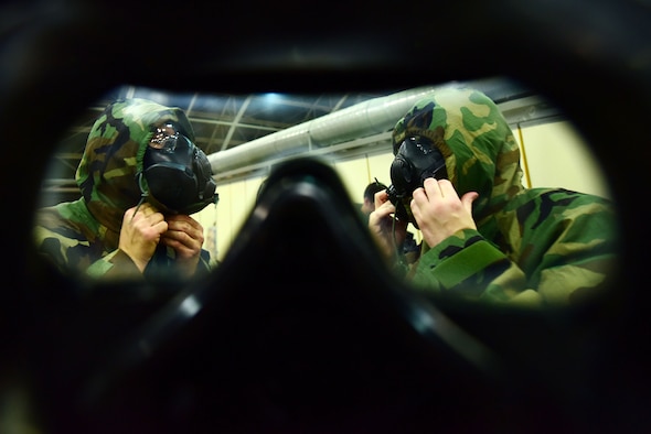 Airmen don M50 gas masks during Ability to Survive and Operate training May 24, 2019, at Incirlik Air Base, Turkey. The training was designed to reinforce Airmen’s ability to utilize their Mission Oriented Protective Posture gear in a potential chemical environment. (U.S. Air Force photo by Tech. Sgt. Jim Araos)