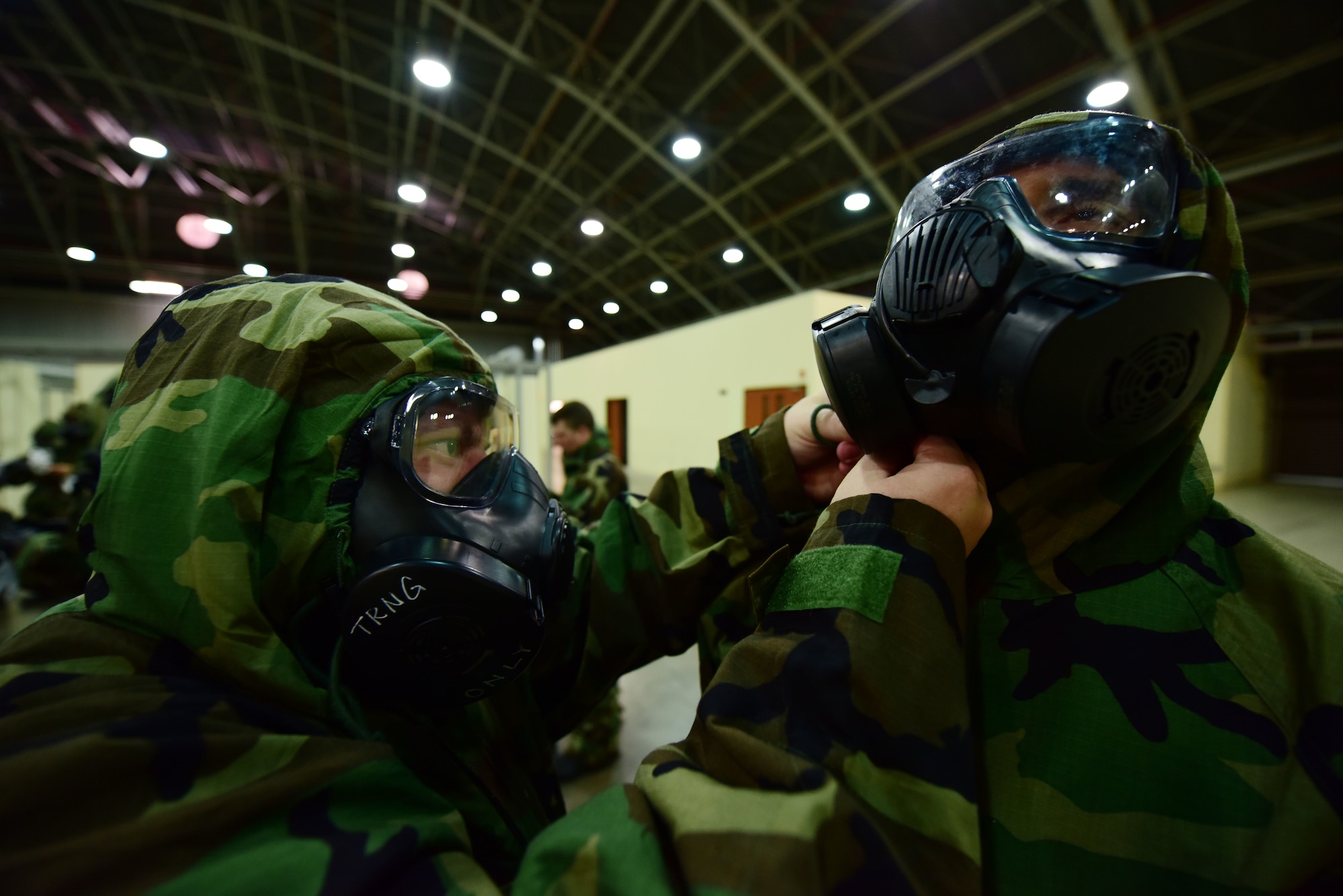 Airmen don M50 gas masks during Ability to Survive and Operate training May 24, 2019, at Incirlik Air Base, Turkey. The M50 gas mask is designed to protect against chemical, biological and radiological environments. (U.S. Air Force photo by Tech. Sgt. Jim Araos)