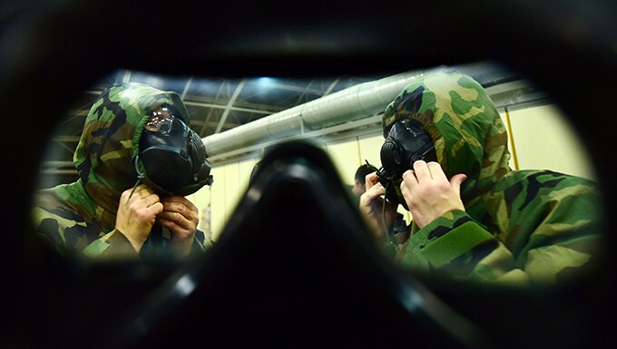 Airmen don M50 gas masks during Ability to Survive and Operate training May 24, 2019, at Incirlik Air Base, Turkey. The training was designed to reinforce Airmen’s ability to utilize their Mission Oriented Protective Posture gear in a potential chemical environment. (U.S. Air Force photo by Tech. Sgt. Jim Araos)