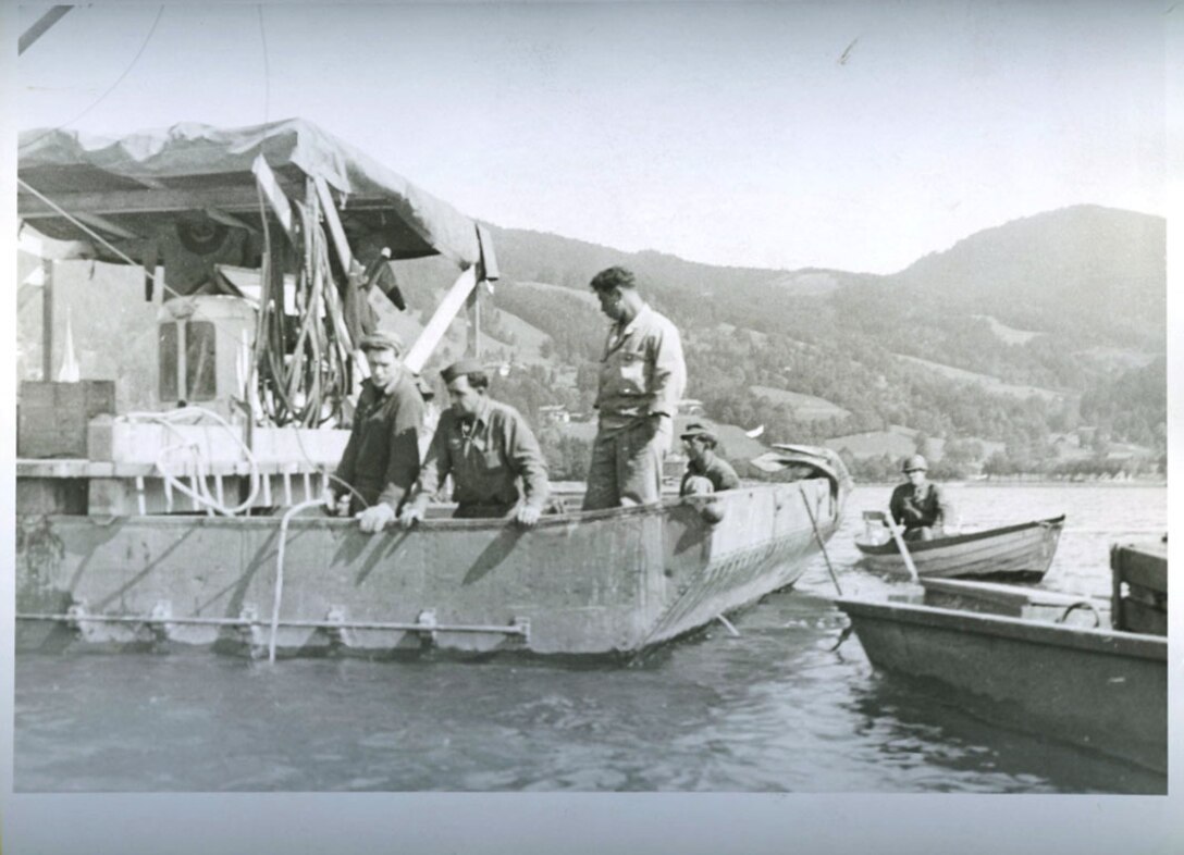 U.S. and U.K. Army Engineers conduct diving operations to recover Nazi cryptologic records sunk in a lake in Bavaria, Germany at the end of World War II