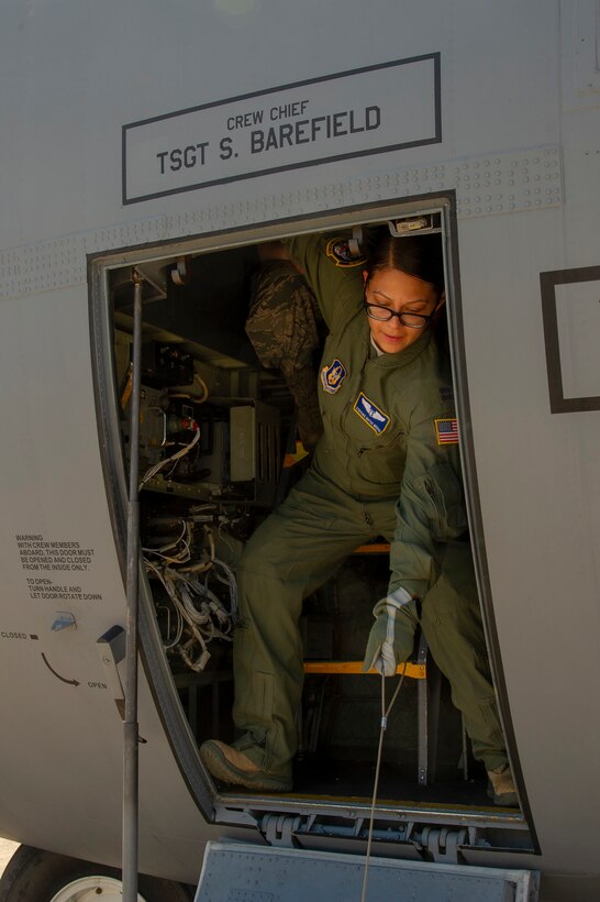 U.S. Air Force Capt. Stefanie Matos, a flight nurse with the 514th Aeromedical Evacuation Squadron, 514th Air Mobility Wing, practices opening the doors on a C-130 Hercules at Stennis International Airport, Kiln, Miss., May 17, 2019. The squadron participated in a Predeployment Dissimilar Aircraft Readiness Training in preparation for their upcoming deployments. (U.S. Air Force photo by 1st Lt. Emily Rautenberg)