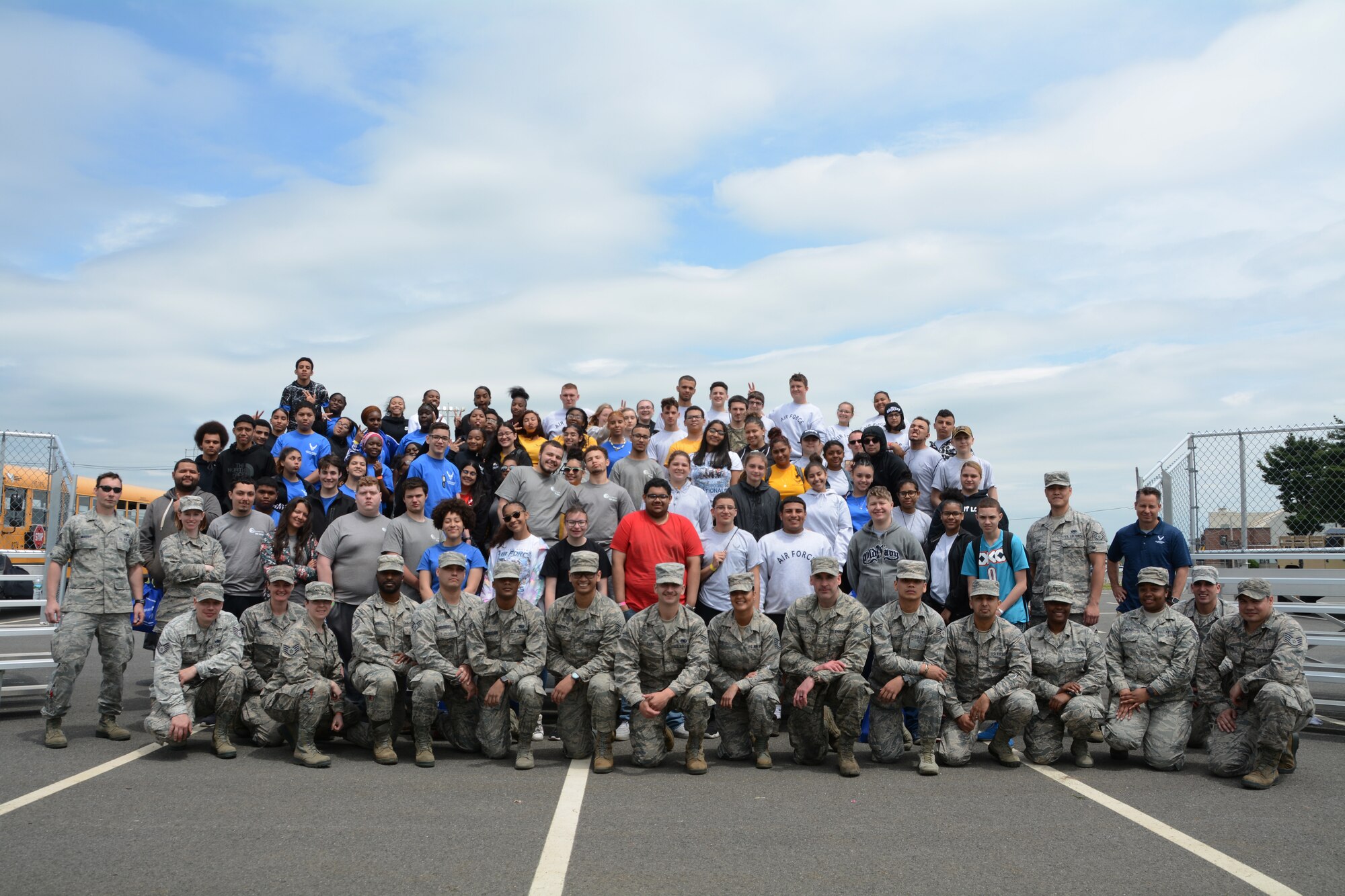 Airmen from the 439th Airlift Wing and students from local high schools pose for a group photo at the conclusion of the 2019 Youth Outreach Day on May 23, at Westover Air Reserve Base, Mass. Youth Outreach day is an annual event put on by the 439th Airlift Wing that ensures a close connection is kept between Westover and the greater community. (U.S. Air Force photo by Senior Airman Hanna Smith)