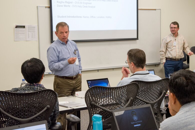 At the start of a two-day class on the data visualization software platform called Qlik Sense, Chip Marin, programs director for the U.S. Army Engineering and Support Center, Huntsville, welcomes students May 8, 2019, and emphasizes the versatility and utility of the software for Huntsville Center’s mission. At right is Ozzy Orwick, Data Visualization Services service owner and Visualization and Analytics Support Tools Community of Practice manager.