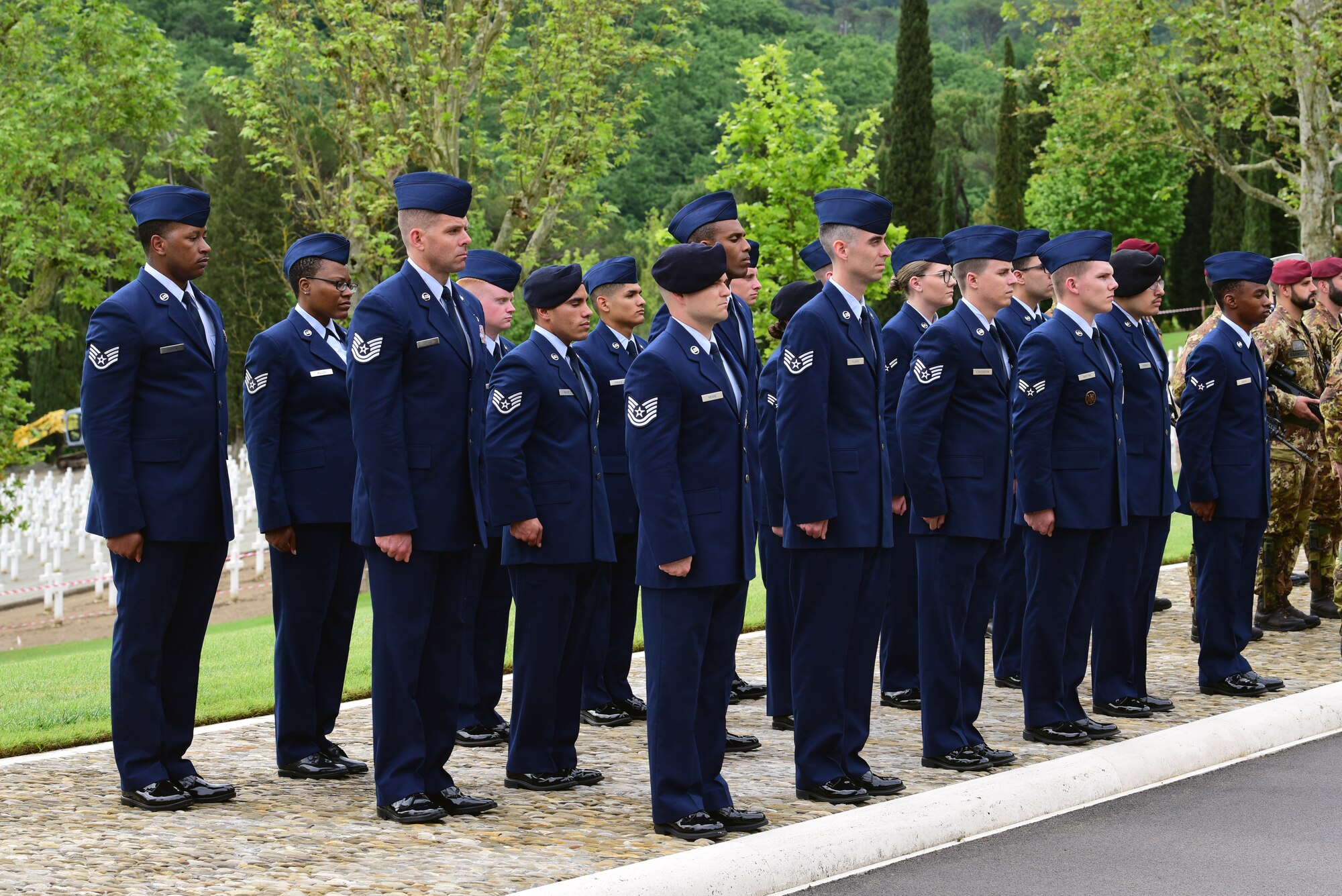 31st Fighter Wing Airmen from Aviano Air Base, Italy stand in formation at the Florence American Cemetery Memorial Day event in Florence, Italy on May 27, 2019. The event honored the fallen and recognized the 75th anniversary of the liberation of Florence by allied forces. (U.S. Air Force photo by Airman 1st Class Caleb House)
